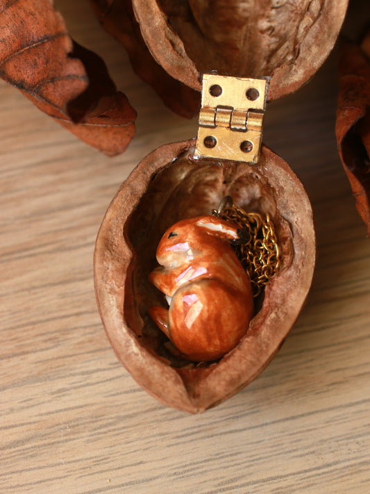 Sleeping bunny necklace in a walnut box