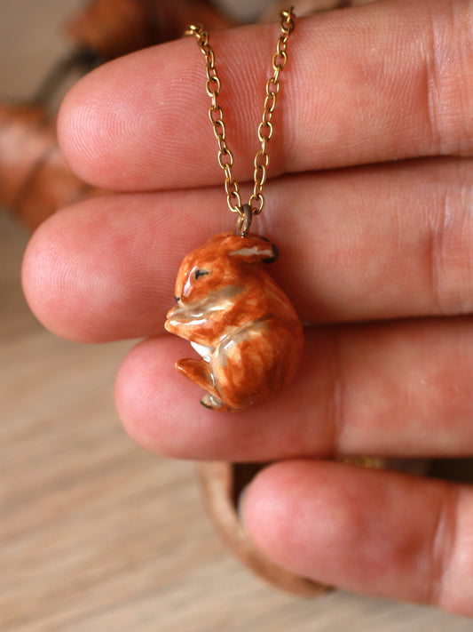 Sleeping bunny necklace in a walnut box