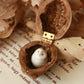 Baby barn owl figure in a walnut box