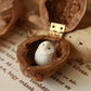 Baby barn owl figure in a walnut box