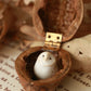 Baby barn owl figure in a walnut box