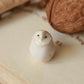 Baby barn owl figure in a walnut box