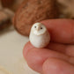 Baby barn owl figure in a walnut box