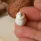 Baby barn owl figure in a walnut box