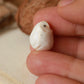 Baby barn owl figure in a walnut box