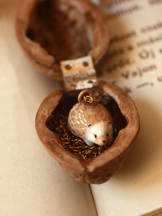 Hedgehog necklace in a walnut box