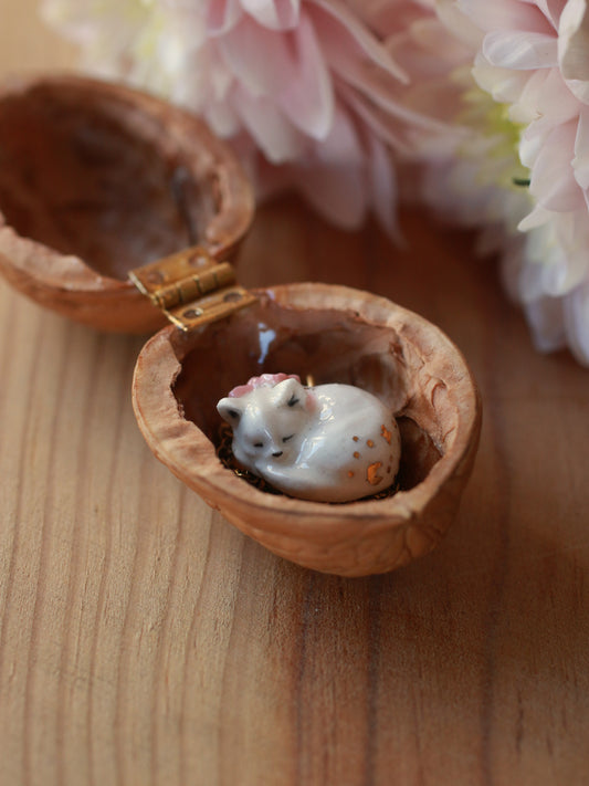 Sleeping cat necklace in a walnut box