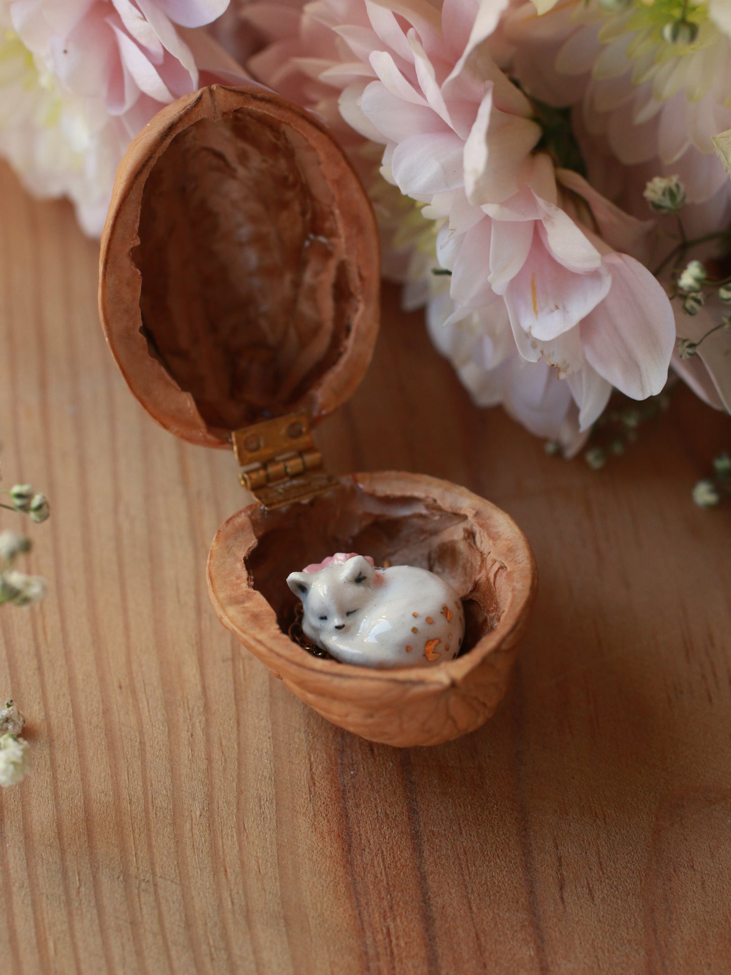 Sleeping cat necklace in a walnut box