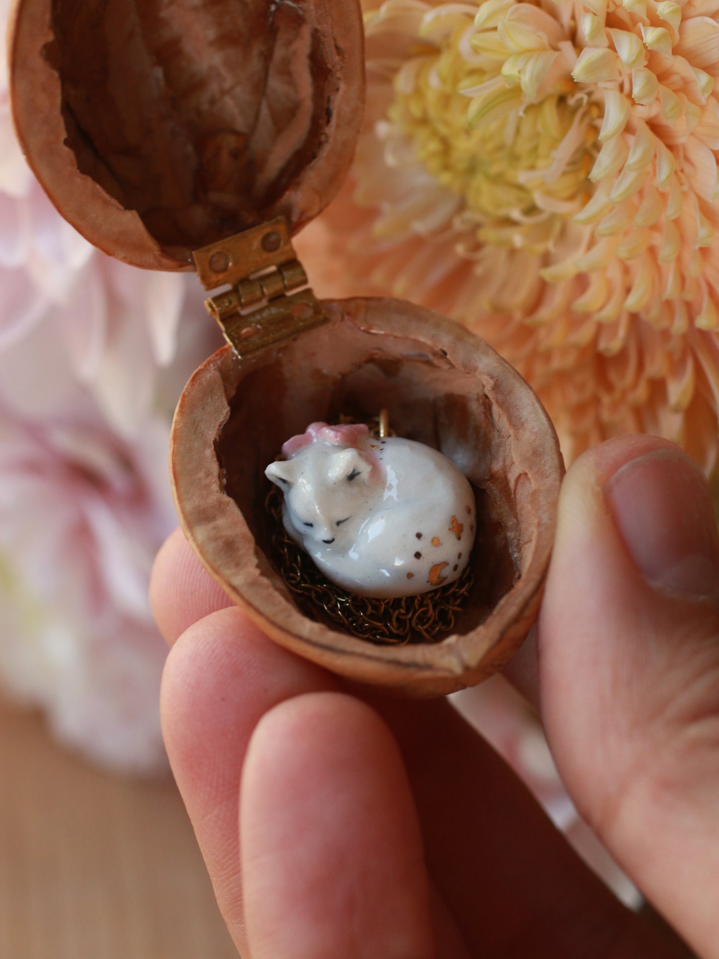 Sleeping cat necklace in a walnut box