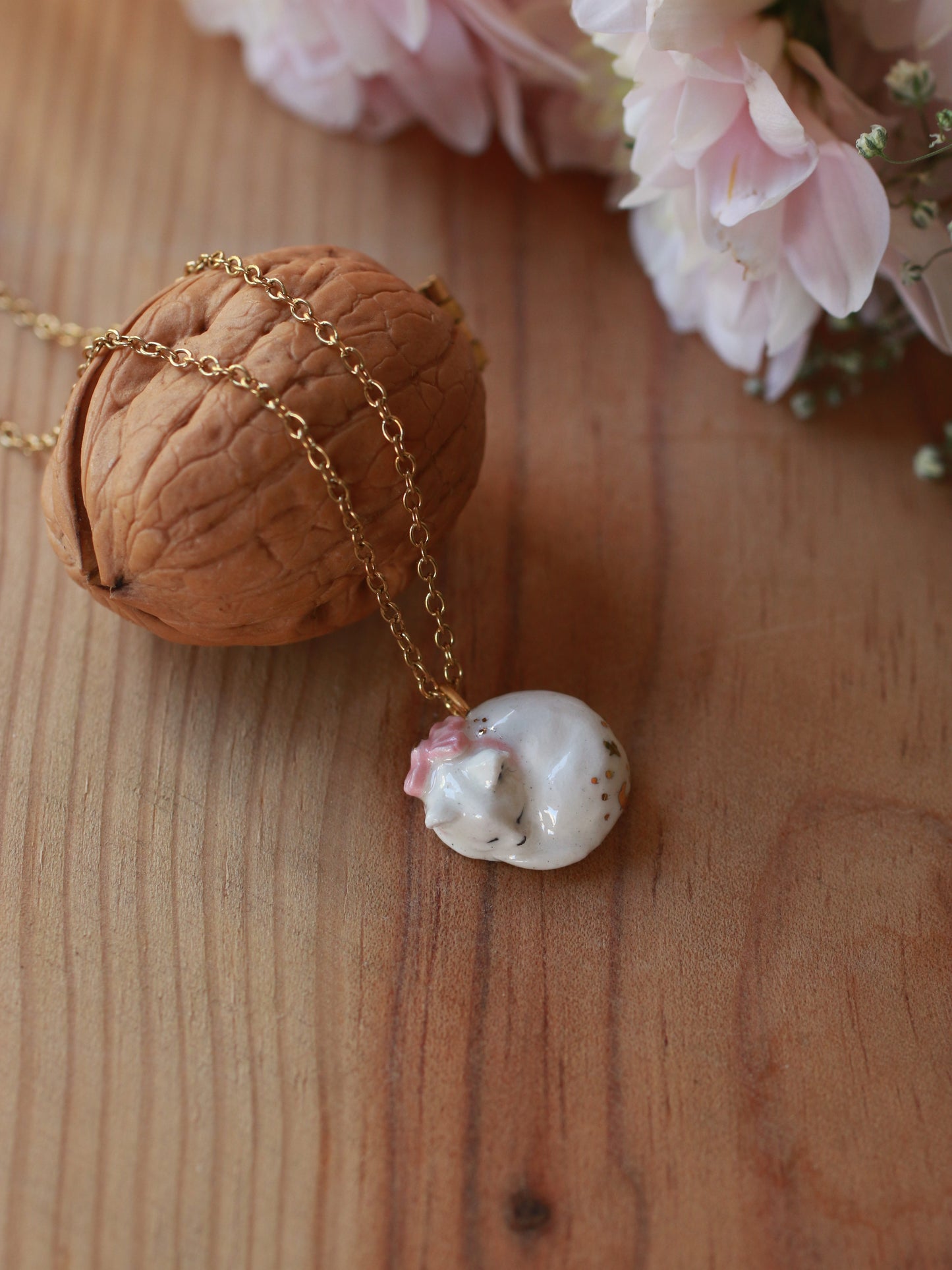 Sleeping cat necklace in a walnut box