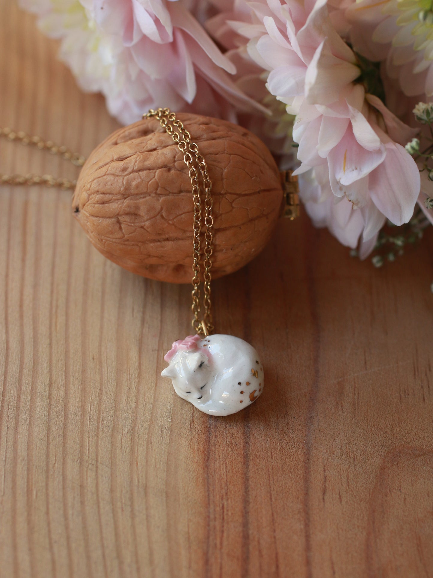 Sleeping cat necklace in a walnut box