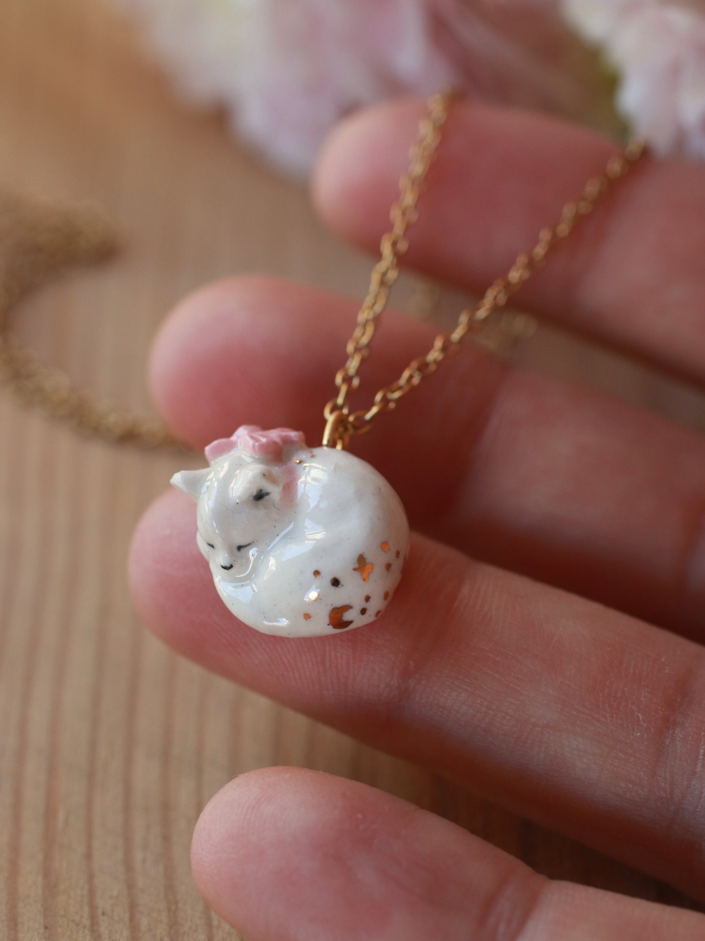 Sleeping cat necklace in a walnut box