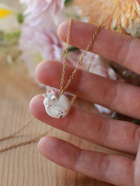 Sleeping cat necklace in a walnut box