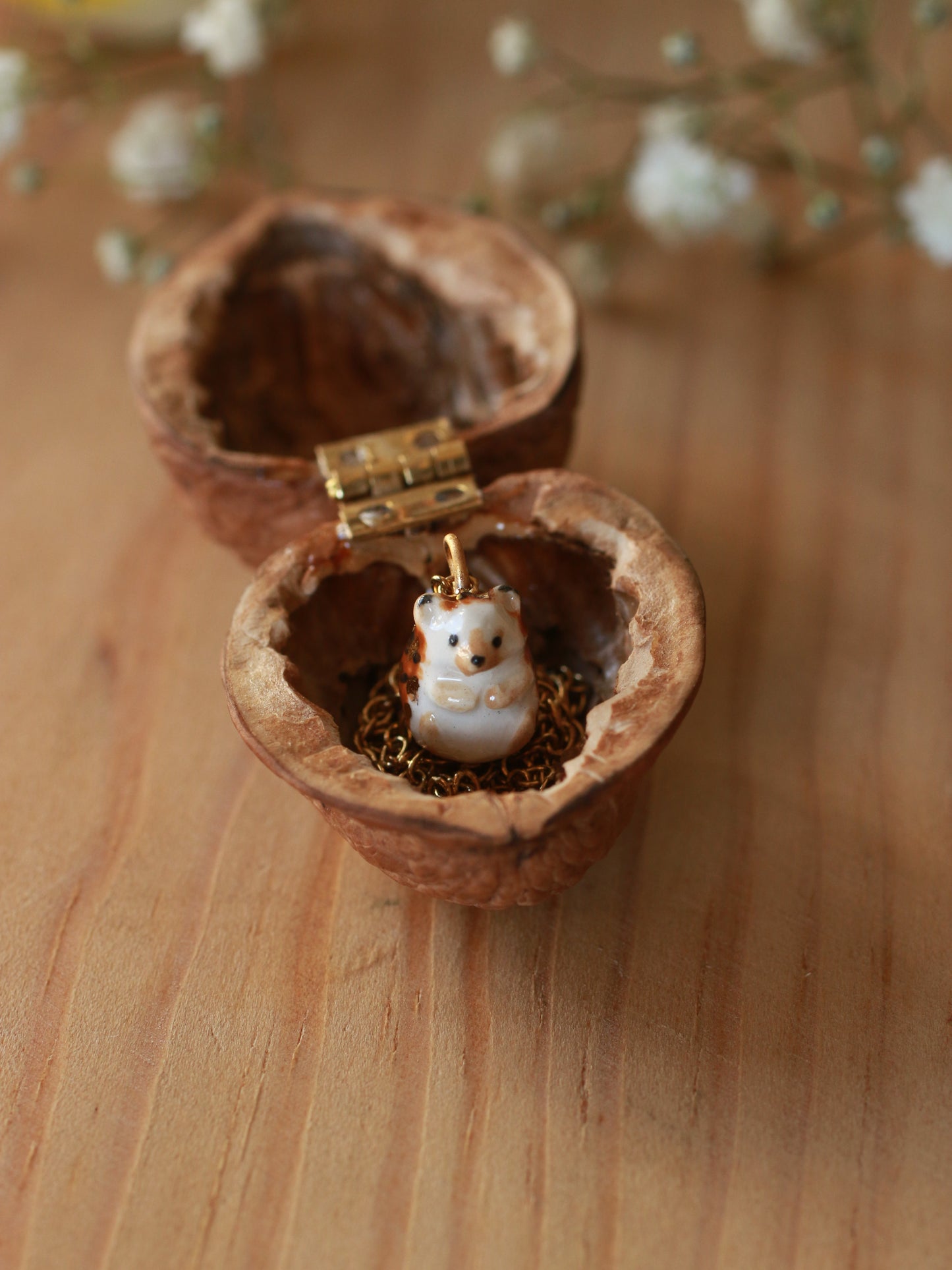 Hedgehog necklace in a walnut box