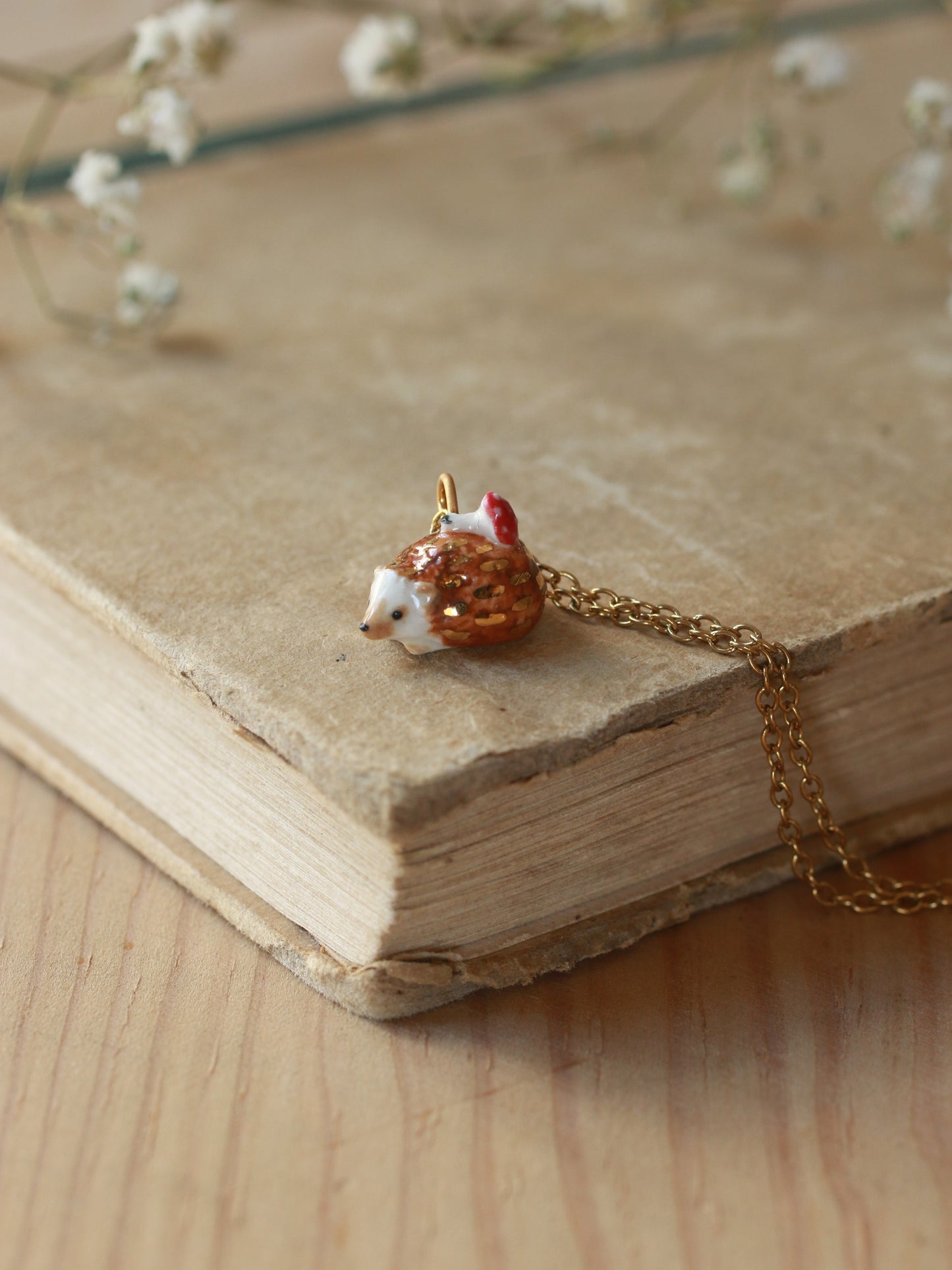 Hedgehog necklace with a tiny mushroom