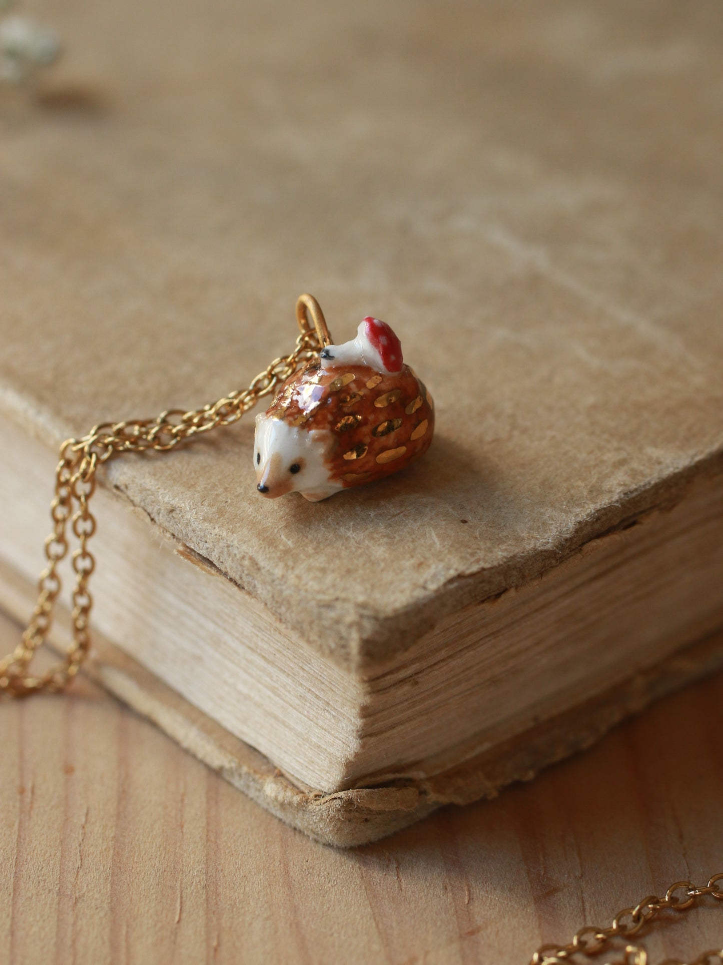 Hedgehog necklace with a tiny mushroom
