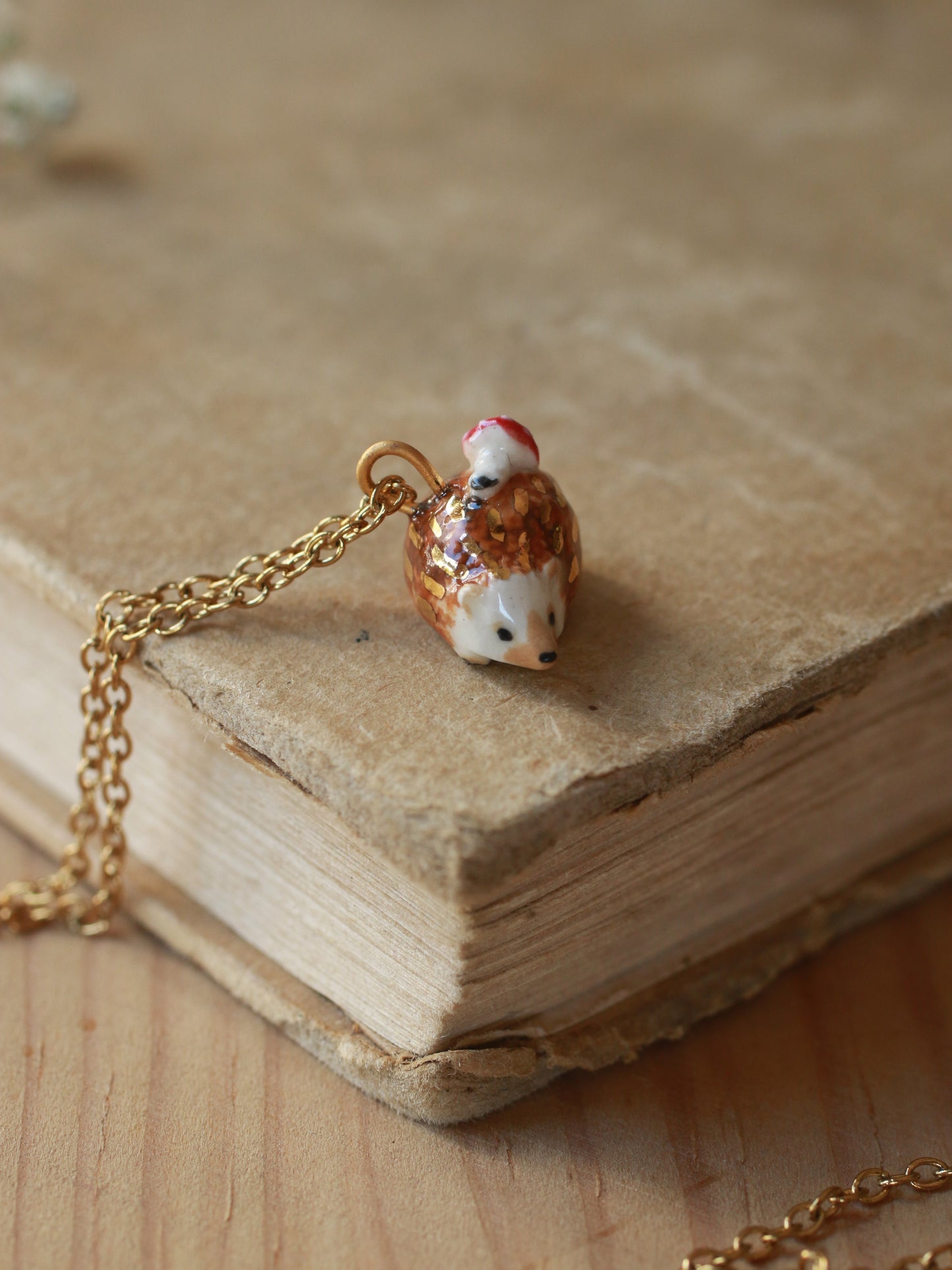 Hedgehog necklace with a tiny mushroom