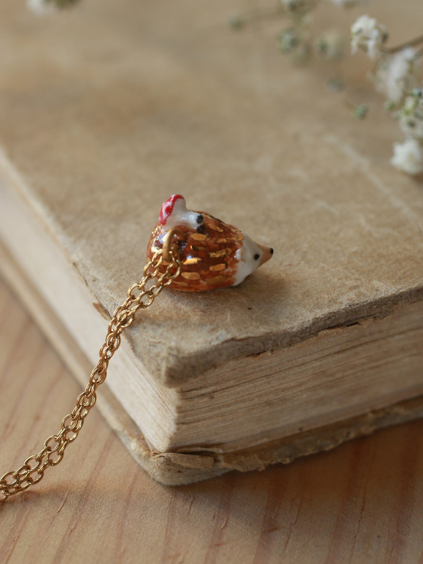 Hedgehog necklace with a tiny mushroom