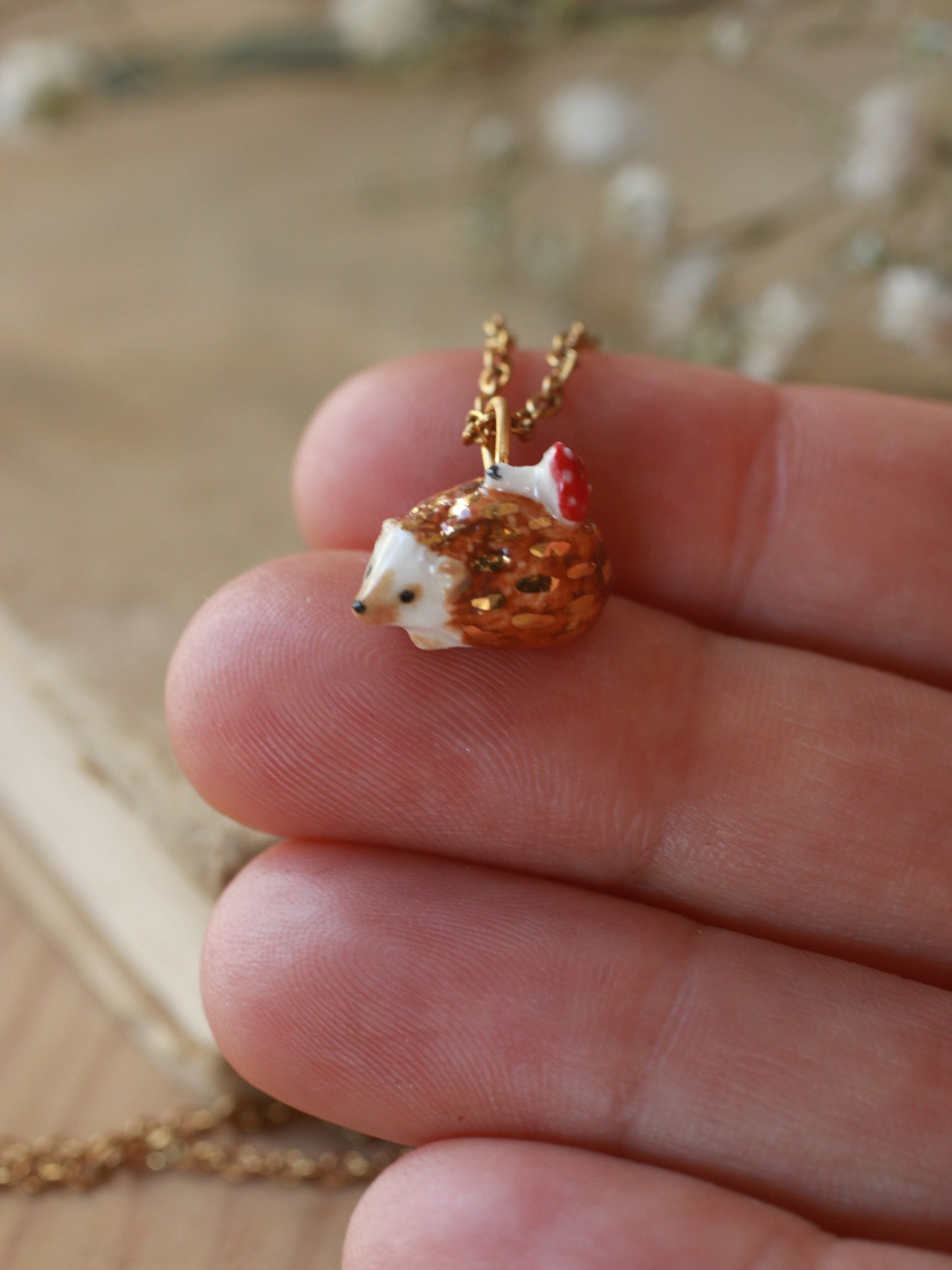 Hedgehog necklace with a tiny mushroom