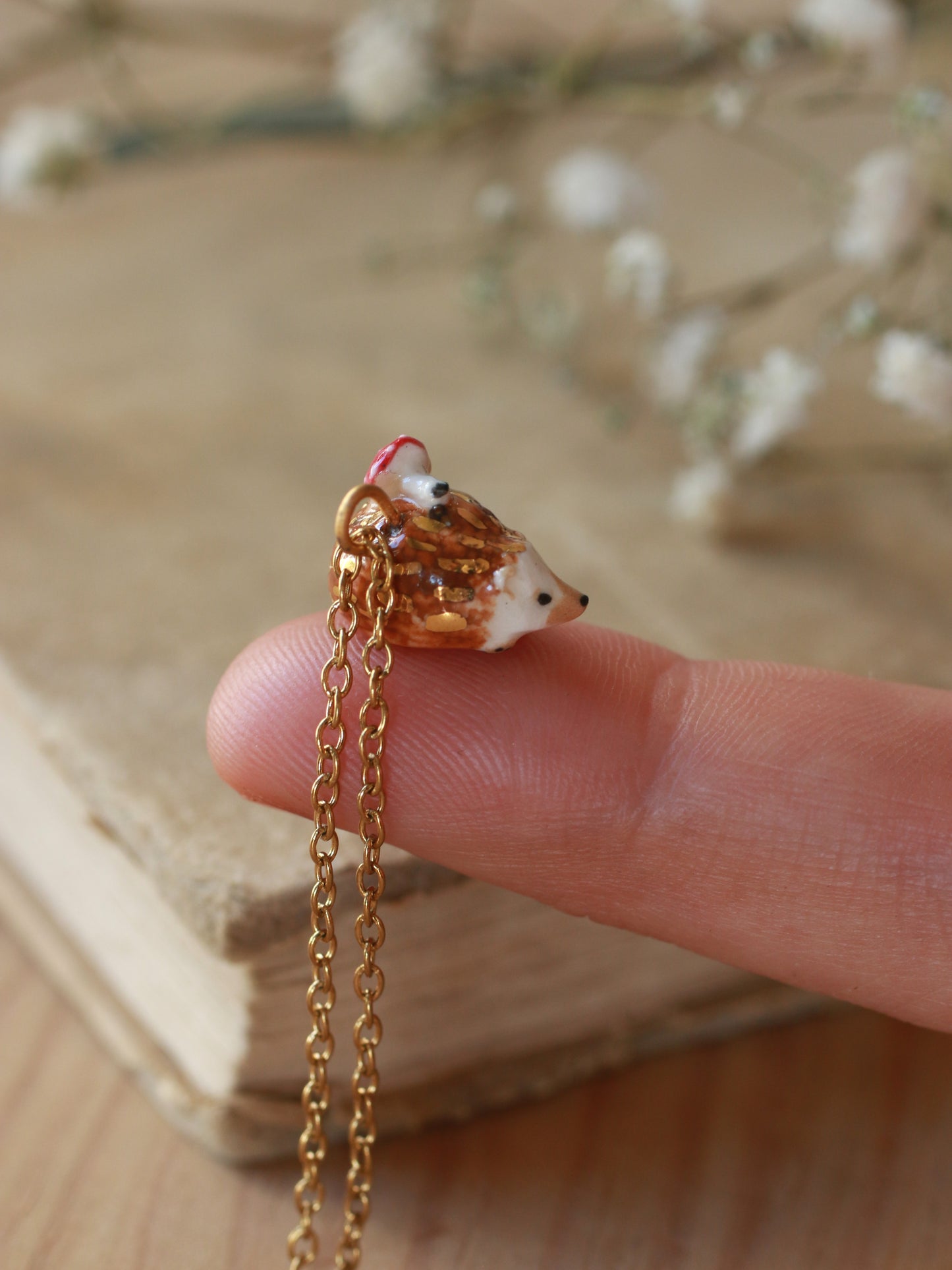 Hedgehog necklace with a tiny mushroom