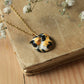 Sleeping calico cat necklace