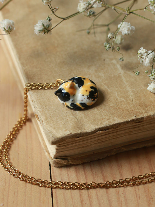 Sleeping calico cat necklace