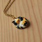 Sleeping calico cat necklace