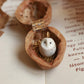 Baby barn owl necklace in a nutshell box