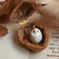 Baby barn owl necklace in a nutshell box