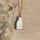 White cat necklace