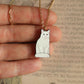 White cat necklace