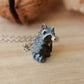 Raccoon necklace in a nutshell box