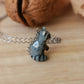 Raccoon necklace in a nutshell box