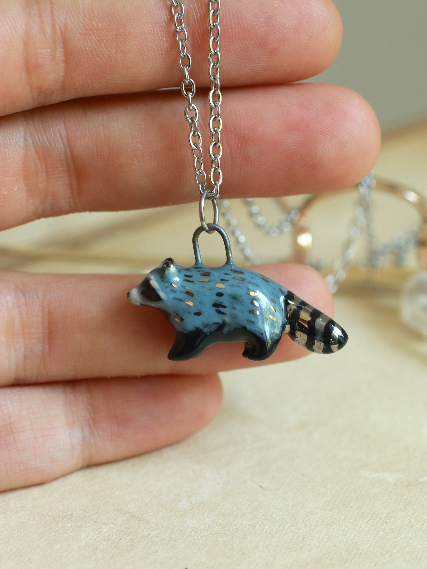Ceramic raccoon necklace - silver details