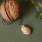 Sleeping bunny necklace in a walnut box