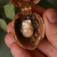 Sleeping bunny necklace in a walnut box