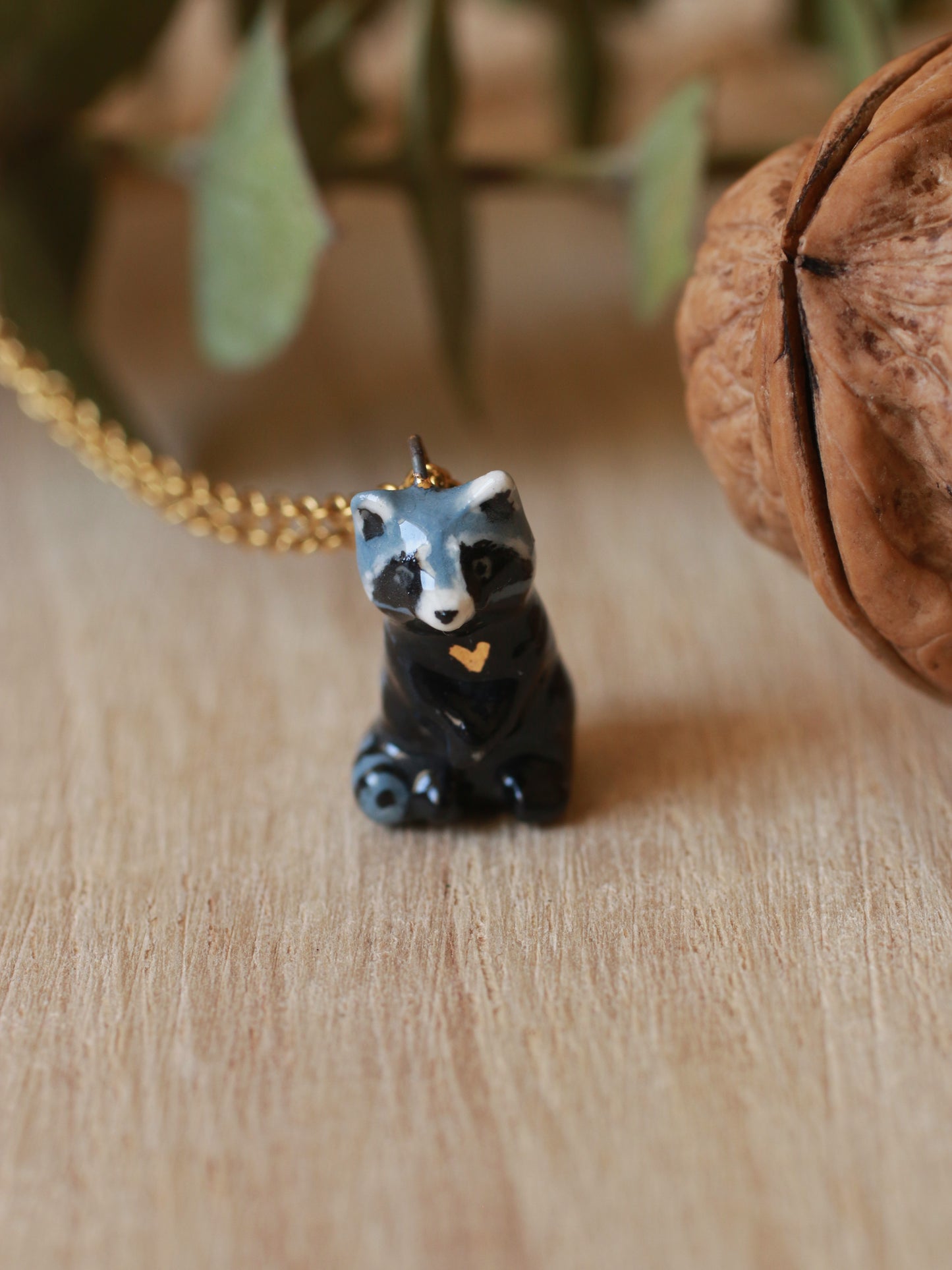 Raccoon necklace in a nutshell box
