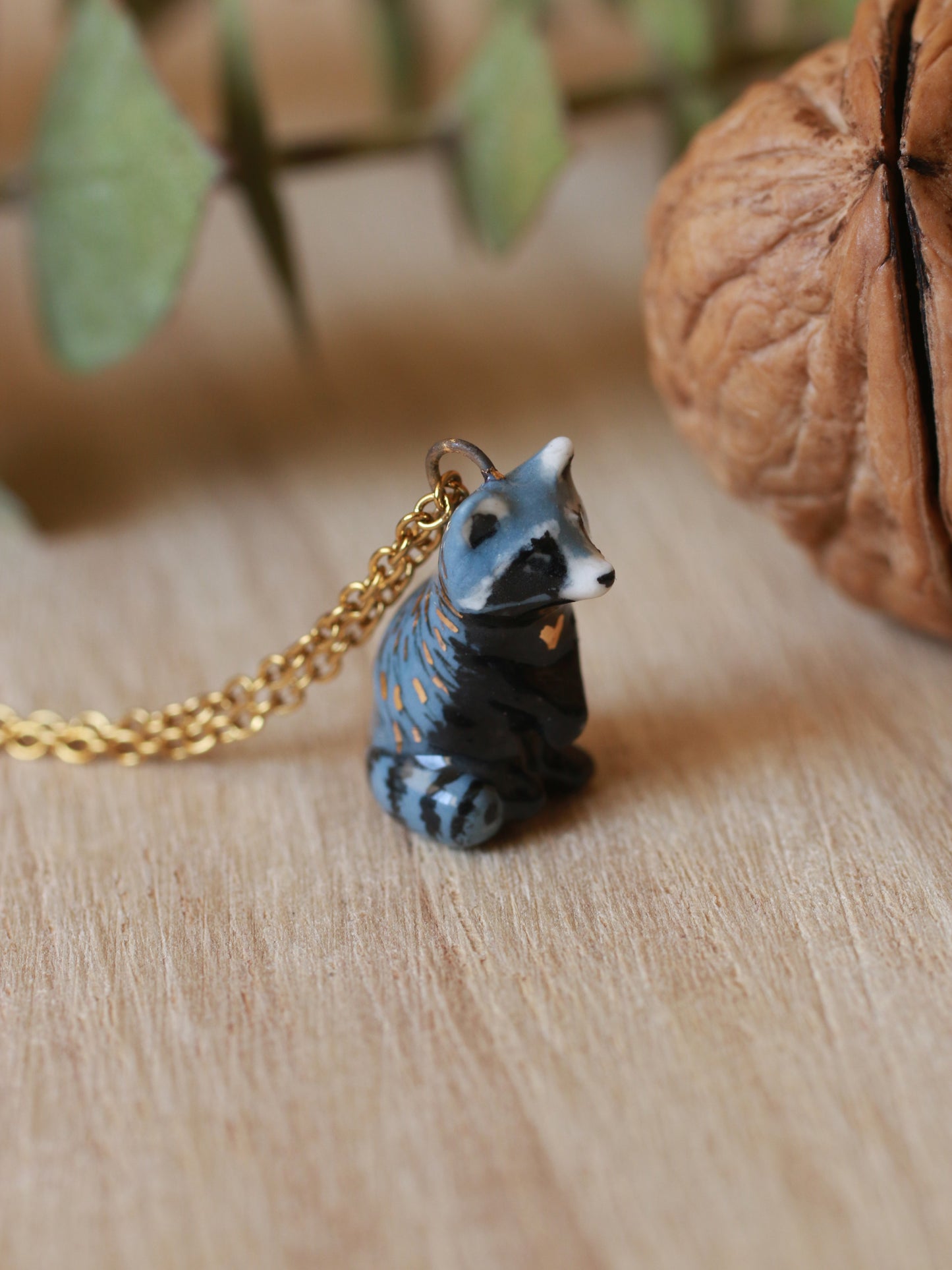 Raccoon necklace in a nutshell box