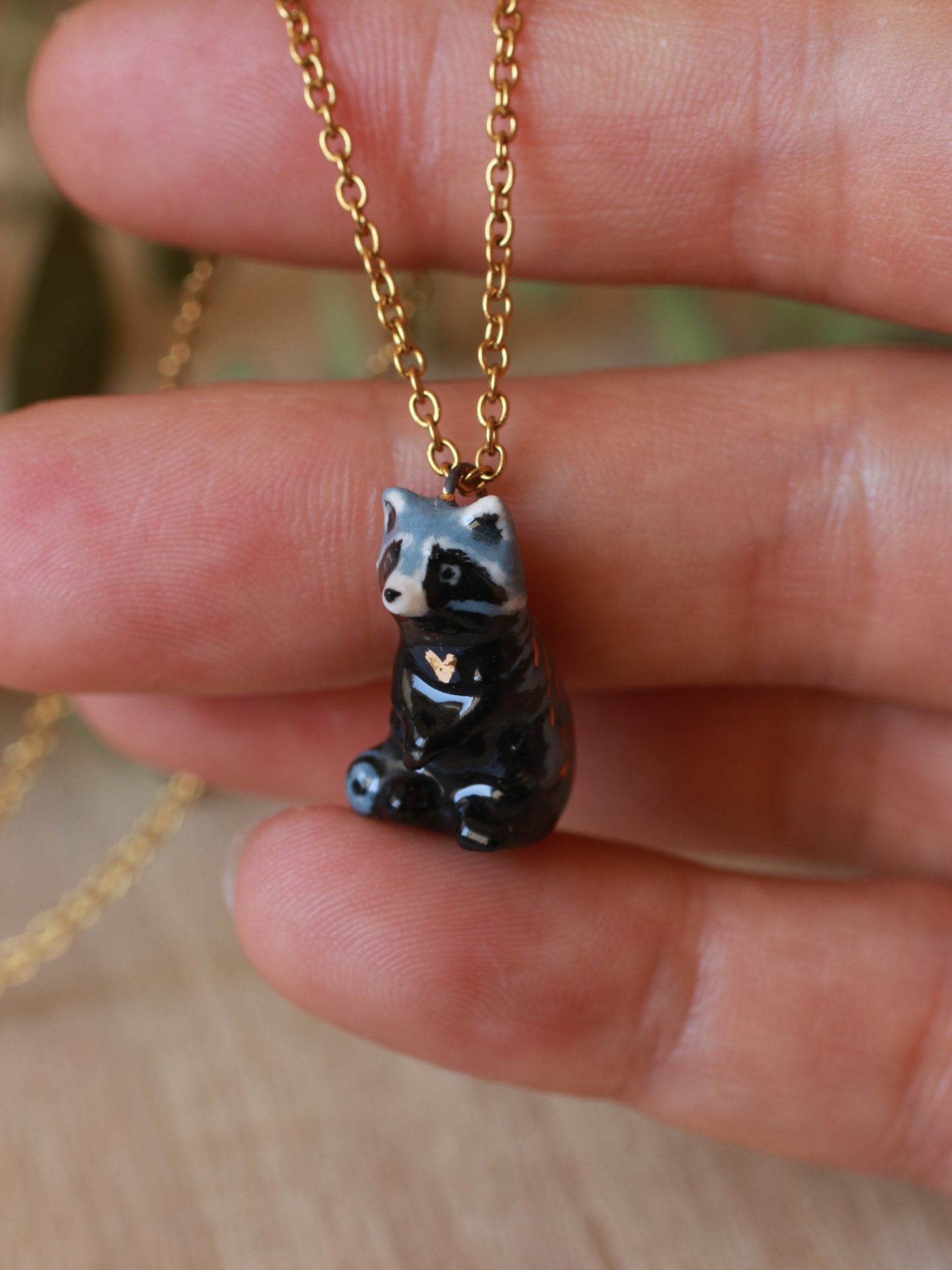 Raccoon necklace in a nutshell box