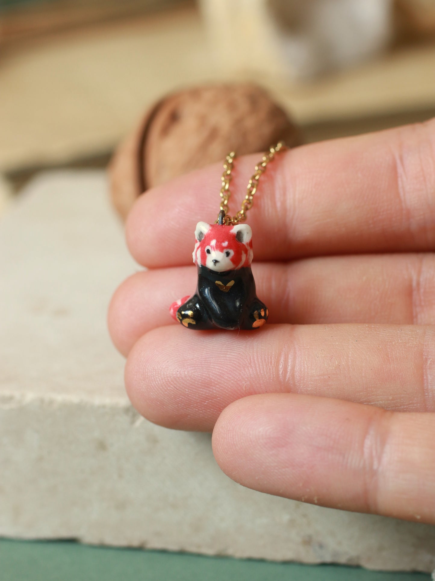 Red Panda necklace in a walnut box
