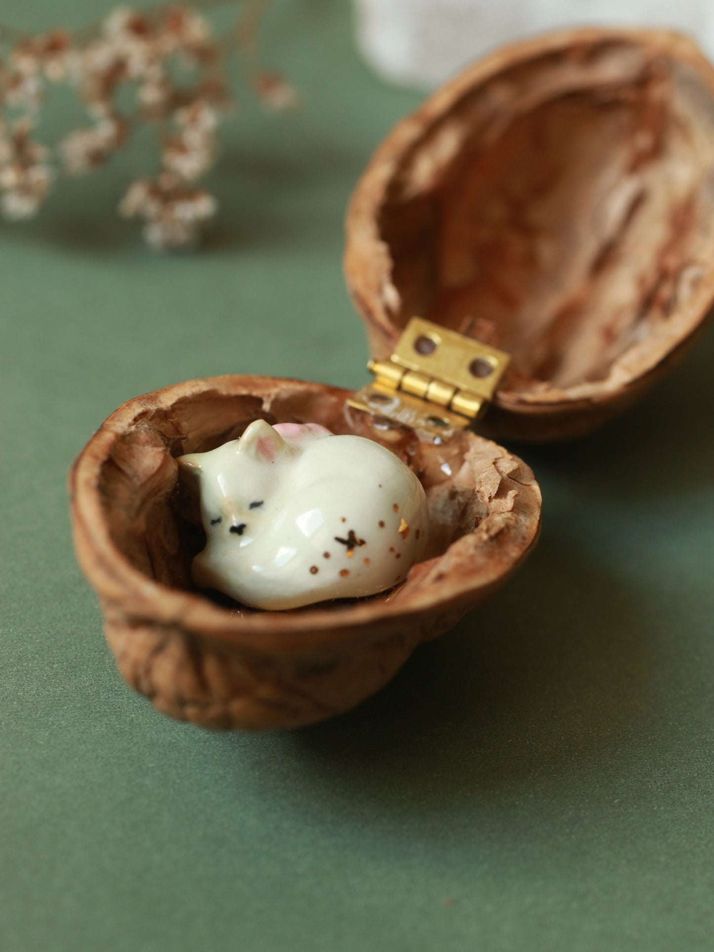 Sleeping cat necklace in a walnut box