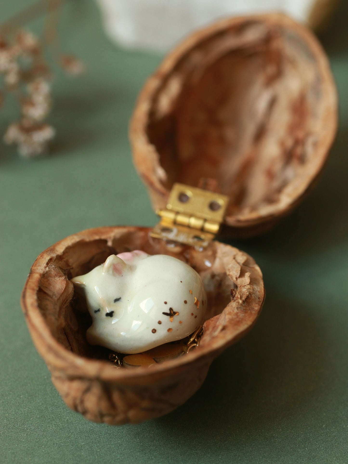 Sleeping cat necklace in a walnut box