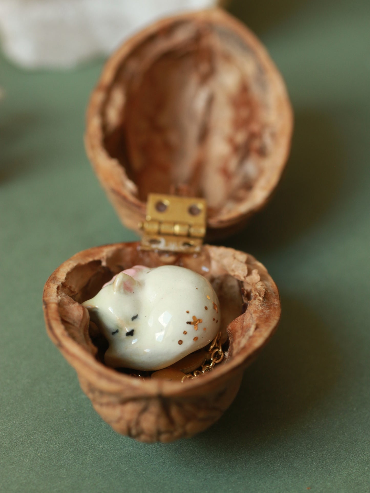 Sleeping cat necklace in a walnut box