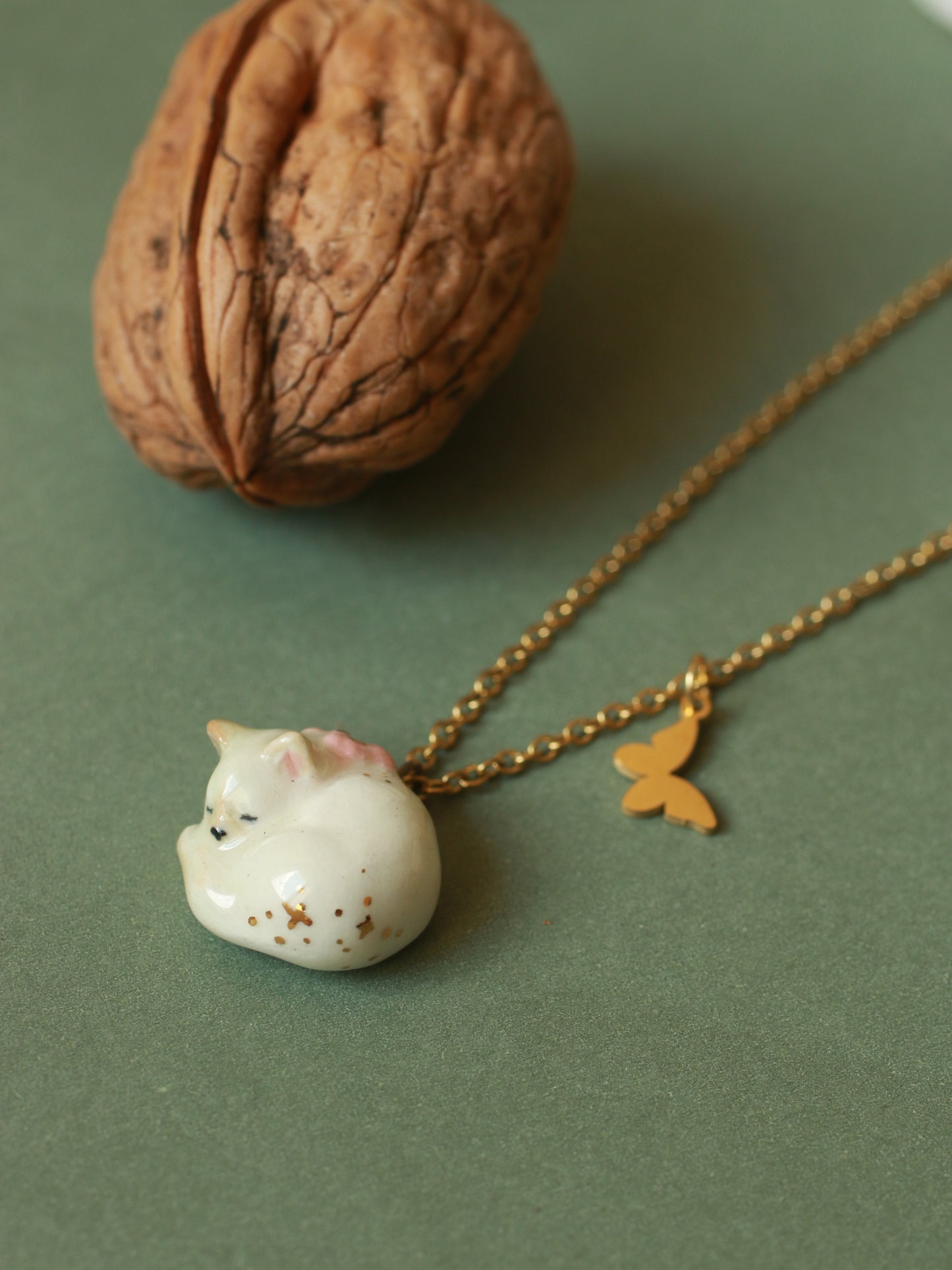 Sleeping cat necklace in a walnut box