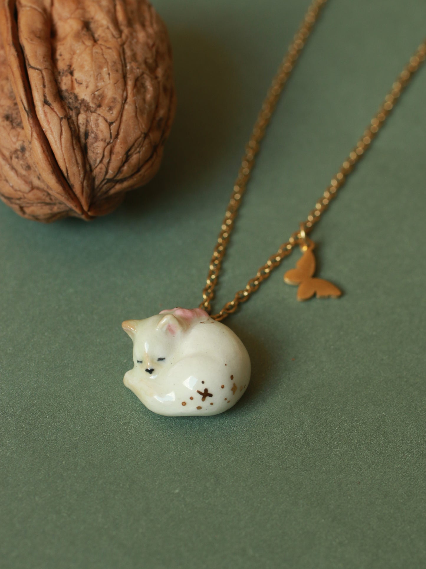 Sleeping cat necklace in a walnut box