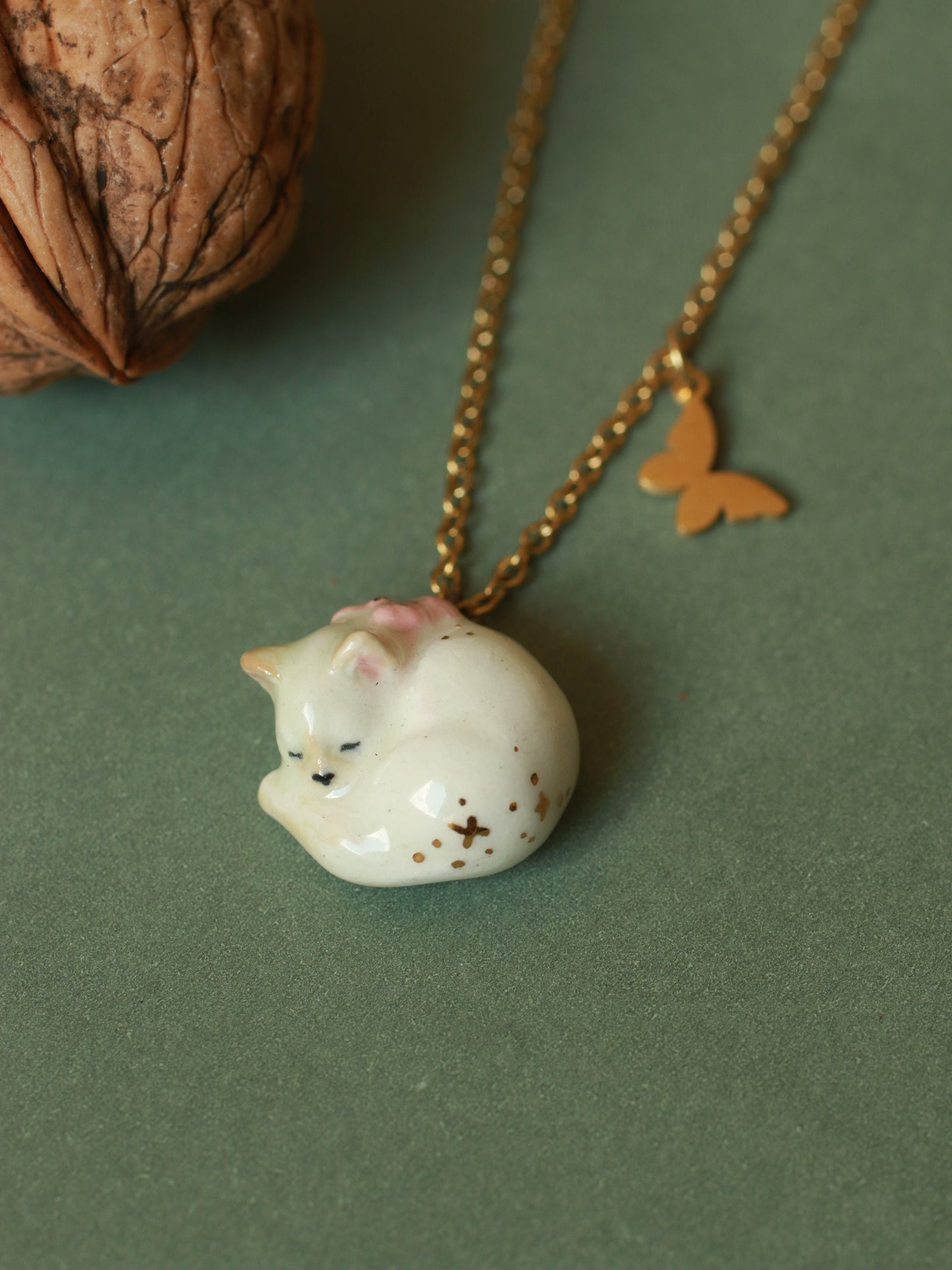 Sleeping cat necklace in a walnut box