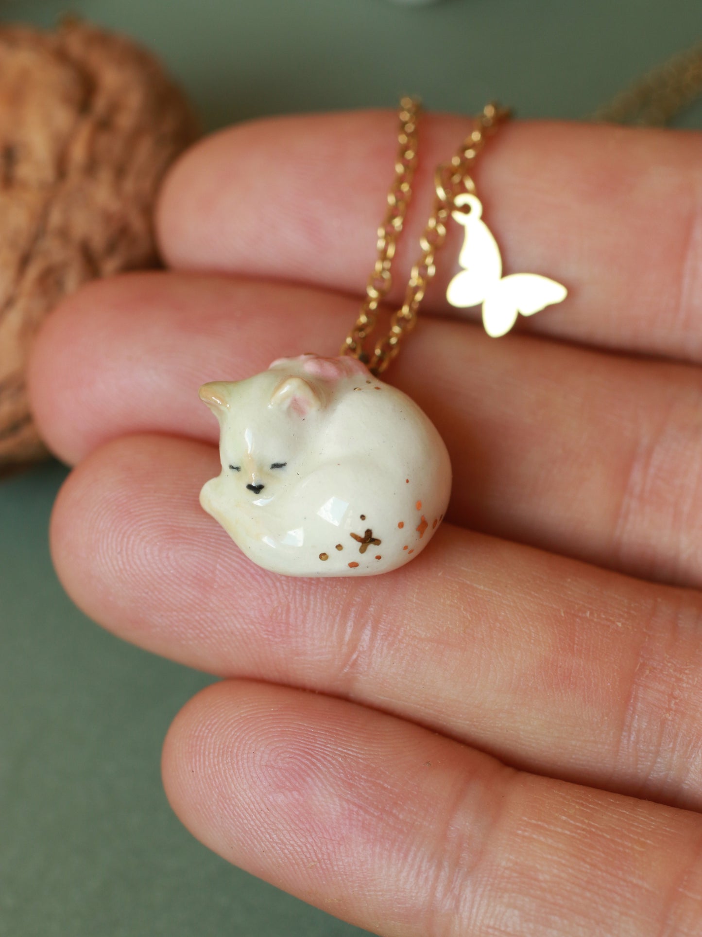 Sleeping cat necklace in a walnut box