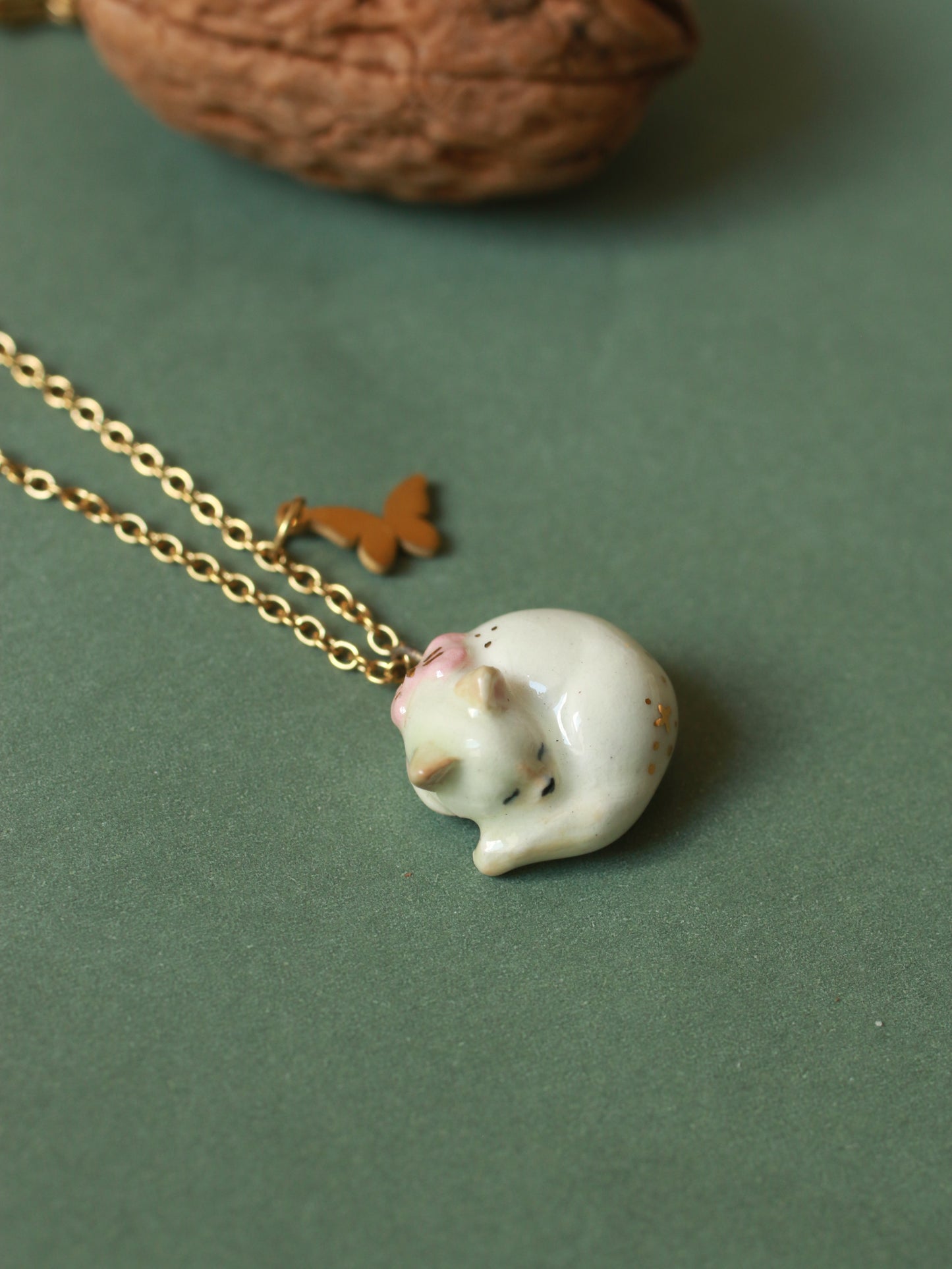 Sleeping cat necklace in a walnut box