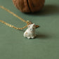 Tiny white cat necklace in a walnut box