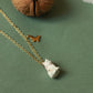 Tiny white cat necklace in a walnut box